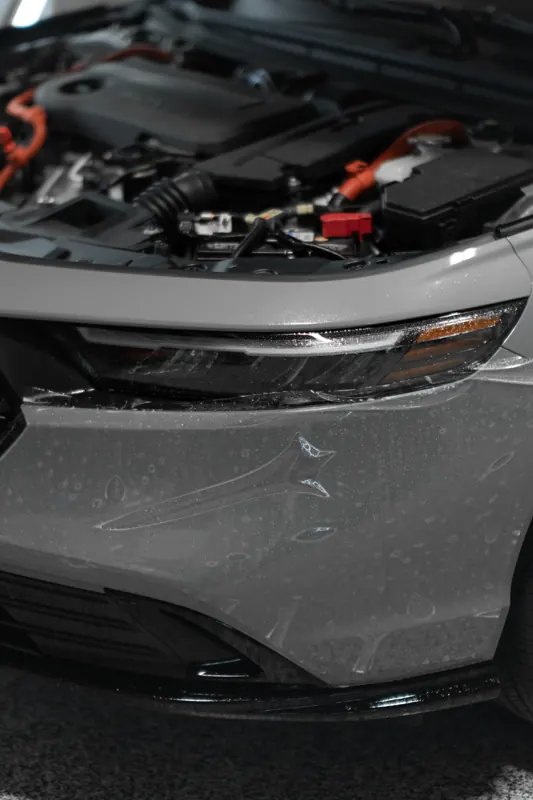 Film visible on the Honda Accord front bumper, hood open