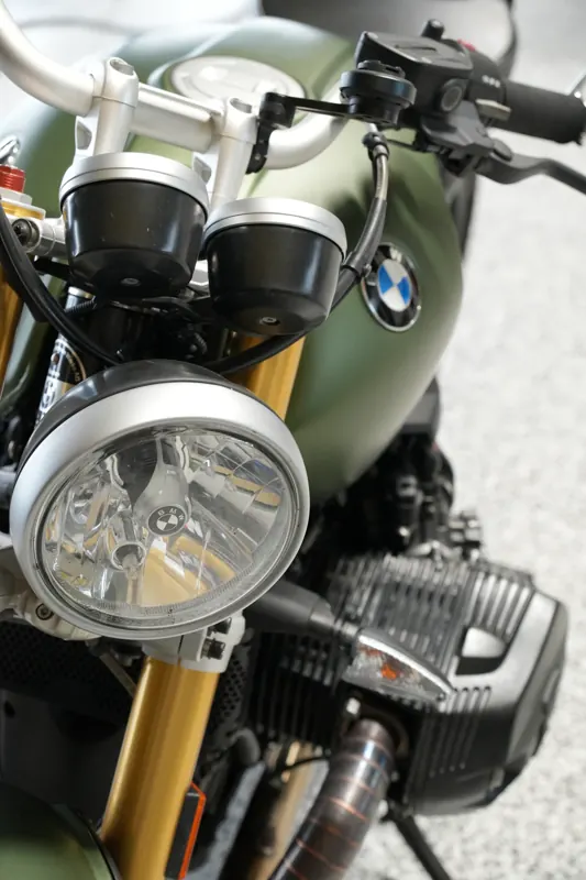 BMW motorcycle in matte army-green wrap, front view