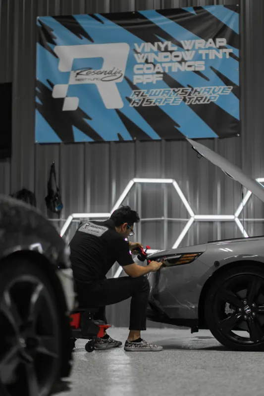 Wide shop shot with the Resendiz banner and an install in progress
